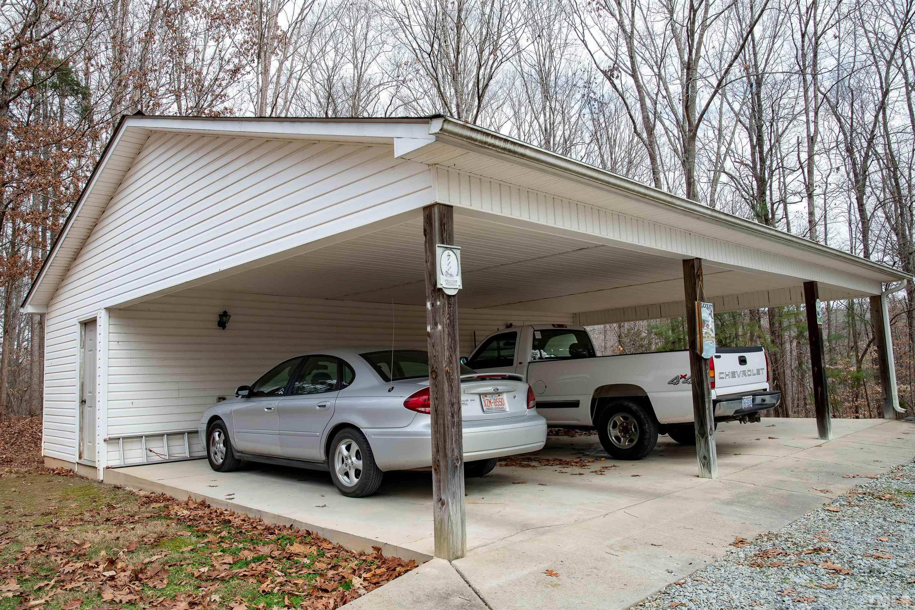 914 Stoney Mountain Road Rougemont, NC 27572 - Photo 19 of 19 a view of parking garage with cars parked