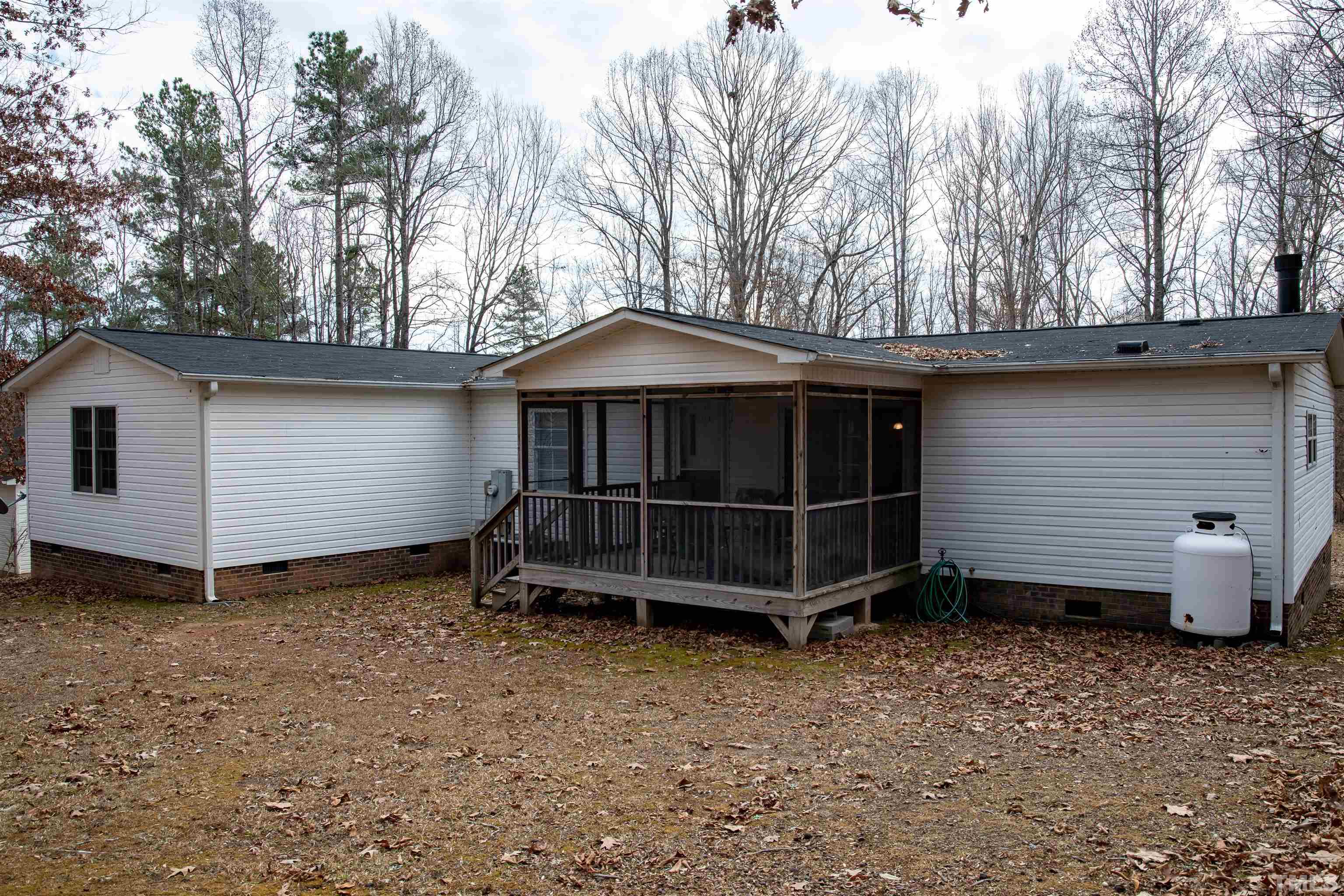 914 Stoney Mountain Road Rougemont, NC 27572 - Photo 4 of 19 a view of backyard with tub and trees