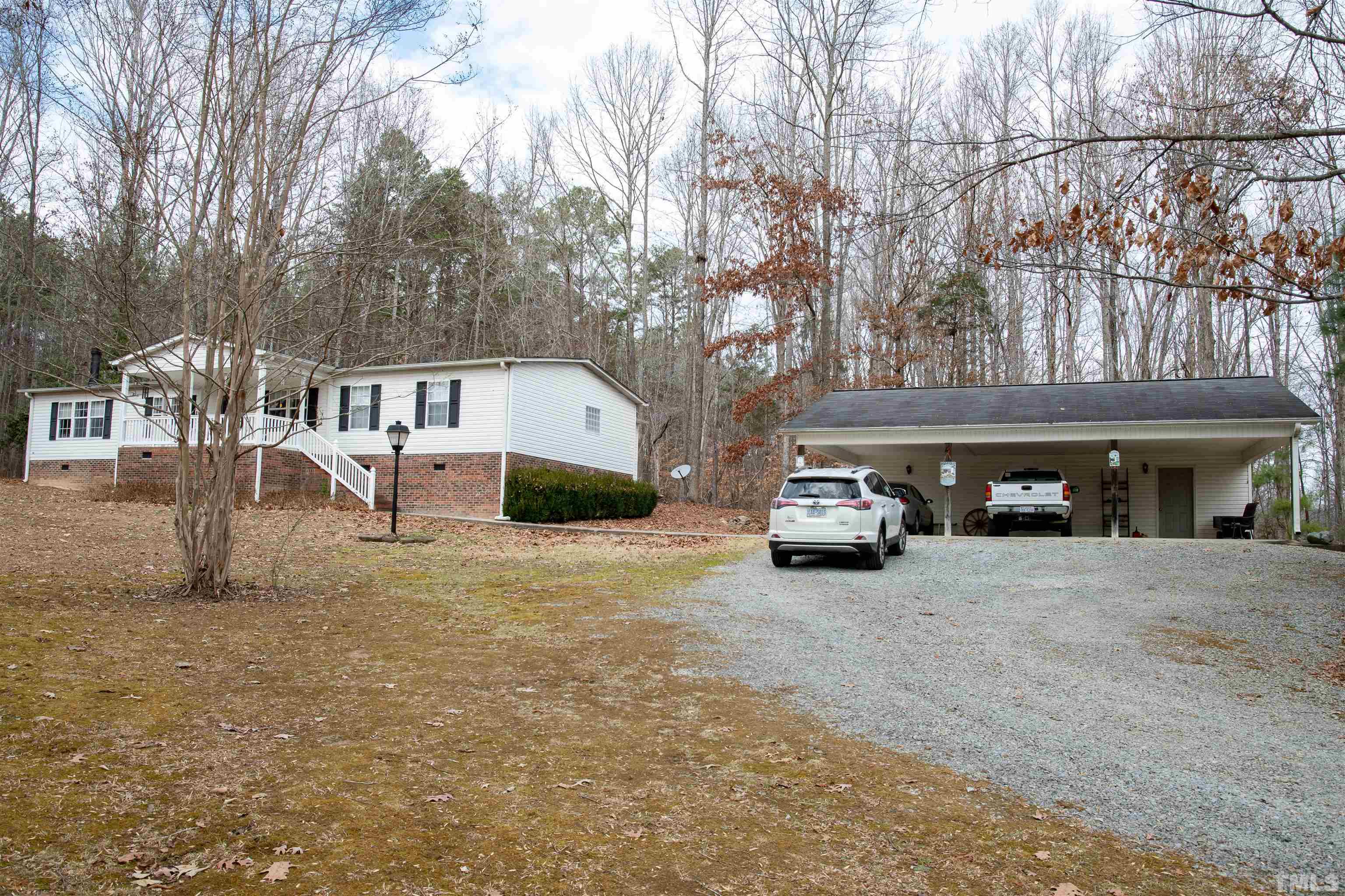 914 Stoney Mountain Road Rougemont, NC 27572 - Photo 5 of 19 a car parked in front of white house