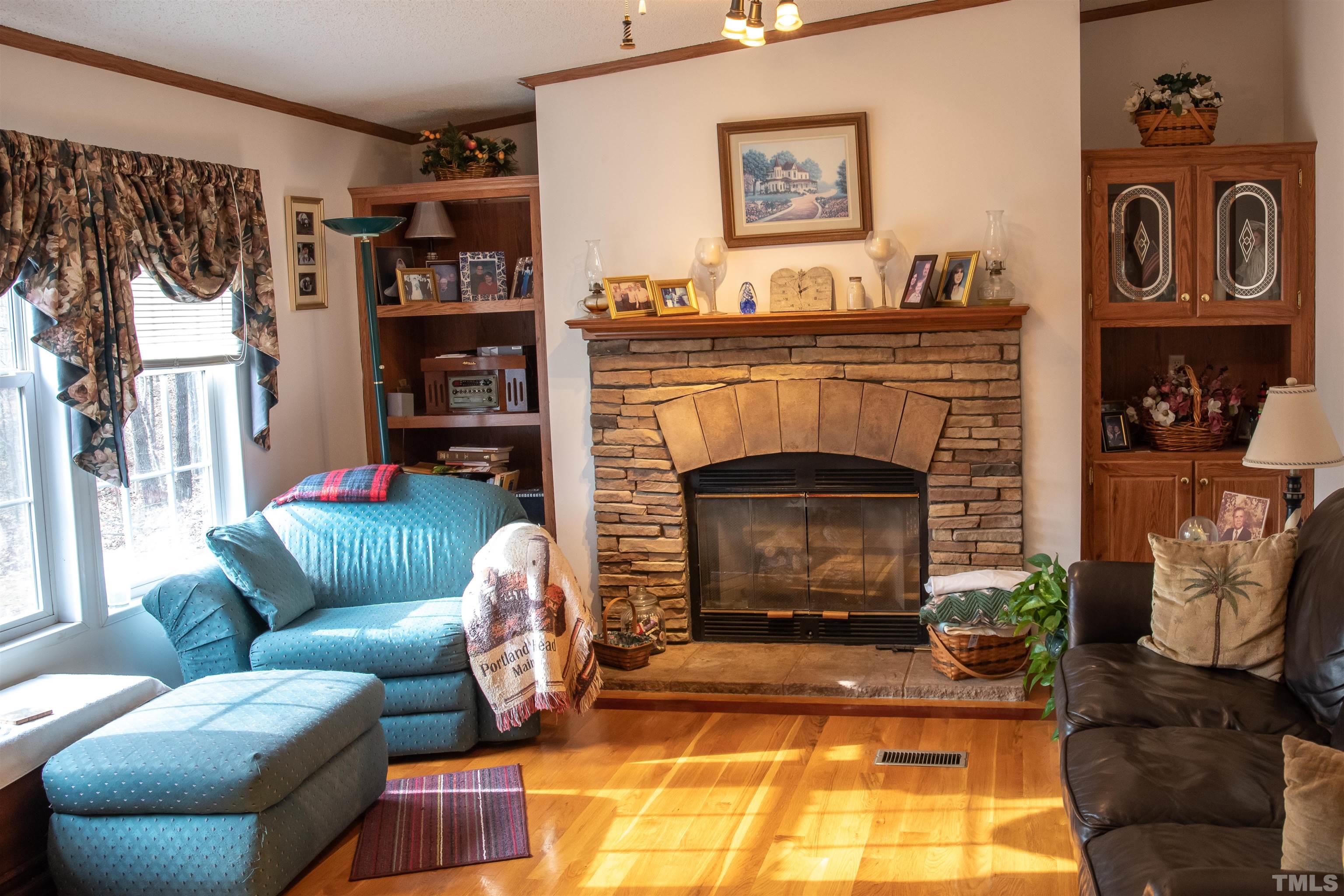 914 Stoney Mountain Road Rougemont, NC 27572 - Photo 6 of 19 a living room with furniture and a fireplace