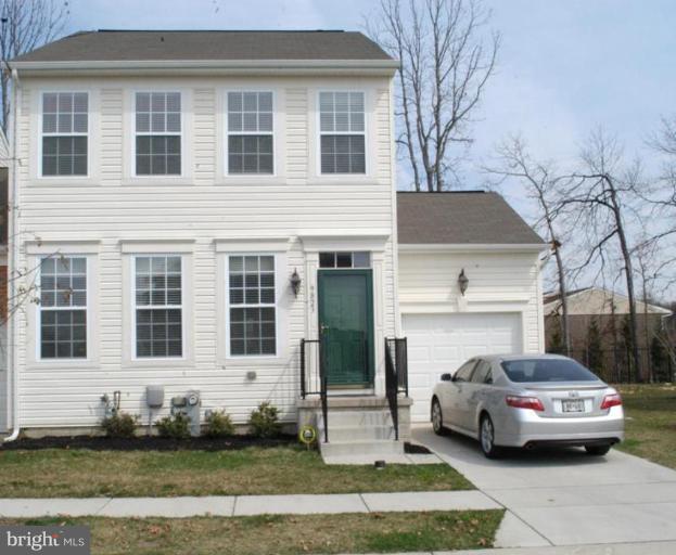 9823 Davison Road Middle River, MD 21220 - Photo 1 of 22 a car parked in front of a house