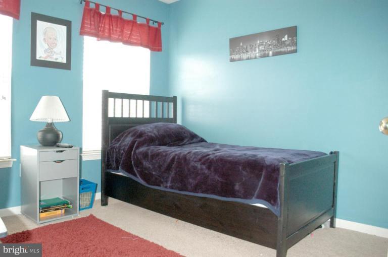 9823 Davison Road Middle River, MD 21220 - Photo 11 of 22 a bedroom with a bed and a window