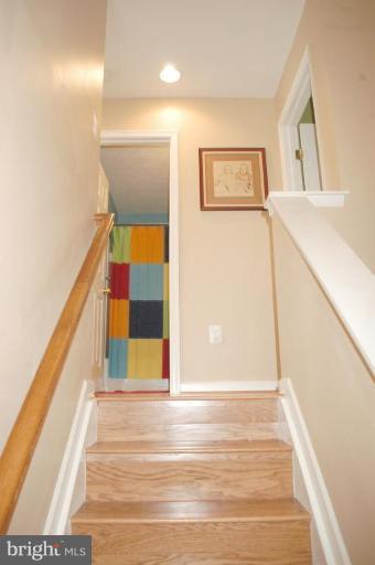 9823 Davison Road Middle River, MD 21220 - Photo 22 of 22 a view of a hallway with wooden floor and staircase