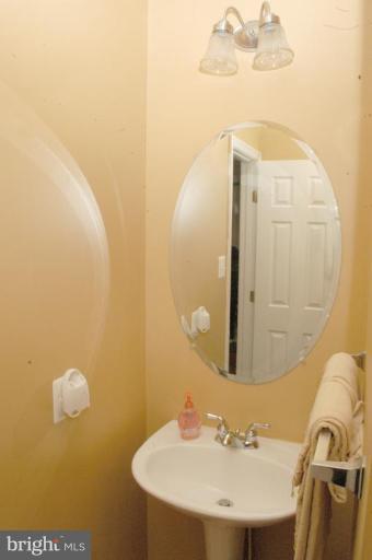 9823 Davison Road Middle River, MD 21220 - Photo 4 of 22 a bathroom with a sink and a mirror