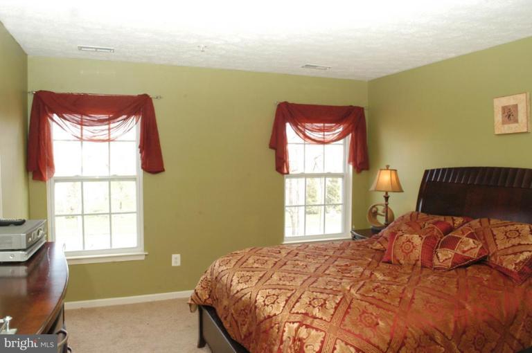 9823 Davison Road Middle River, MD 21220 - Photo 10 of 22 a bedroom with a bed and a window