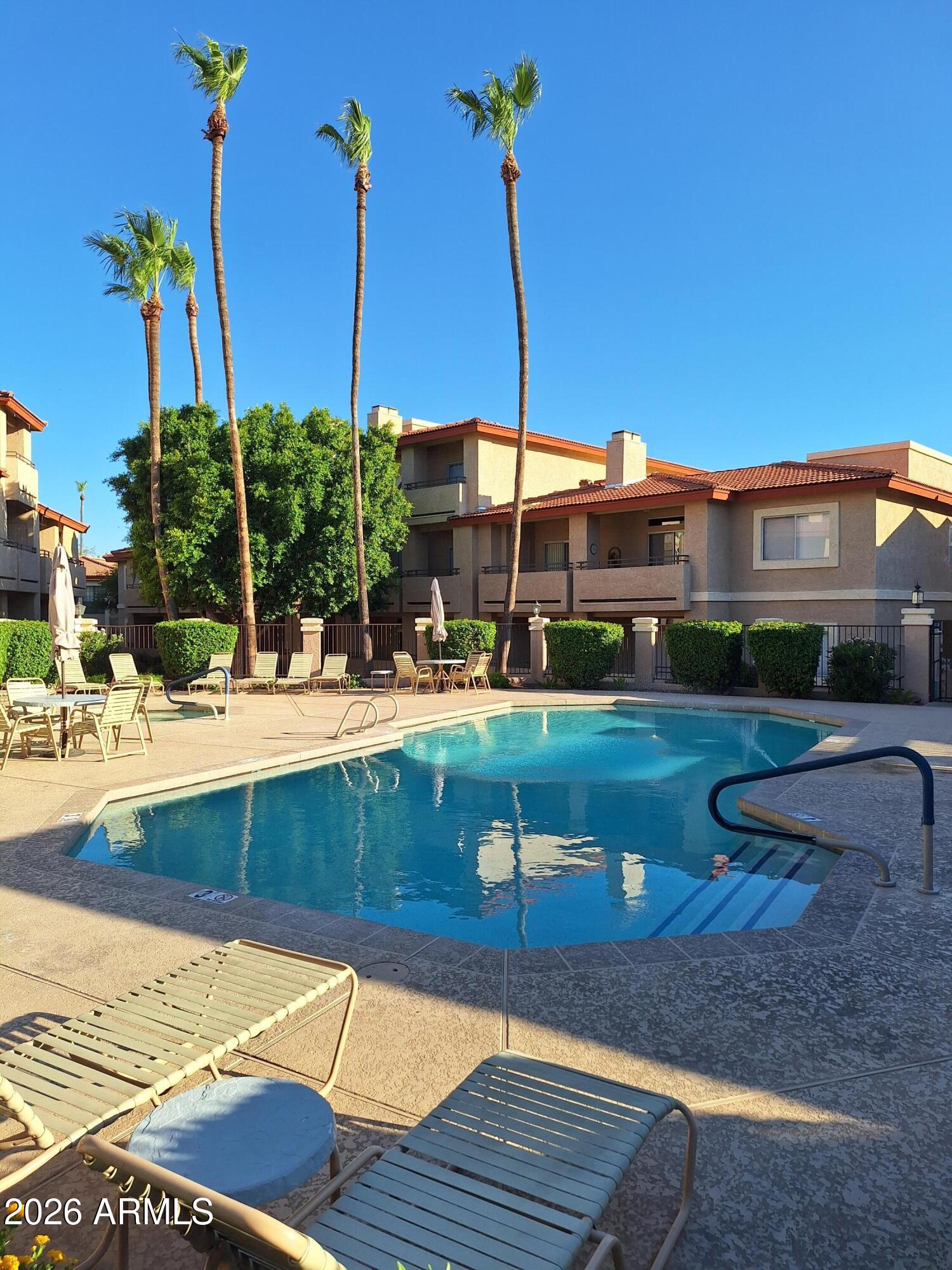 a view of a swimming pool with a patio