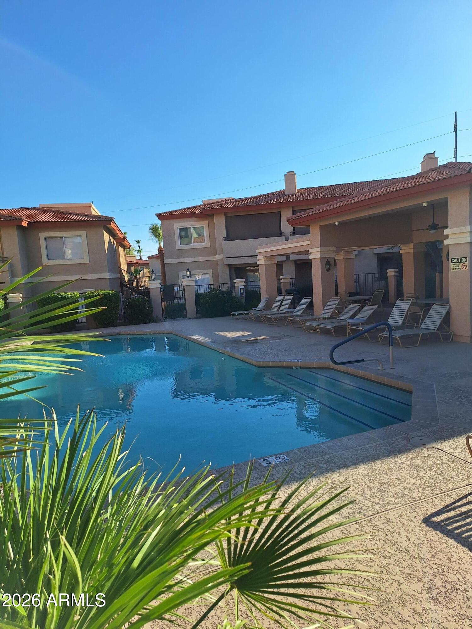10410 North Cave Creek Road, Unit 2063 Phoenix, AZ 85020 - Photo 12 of 49 a view of a house with a yard