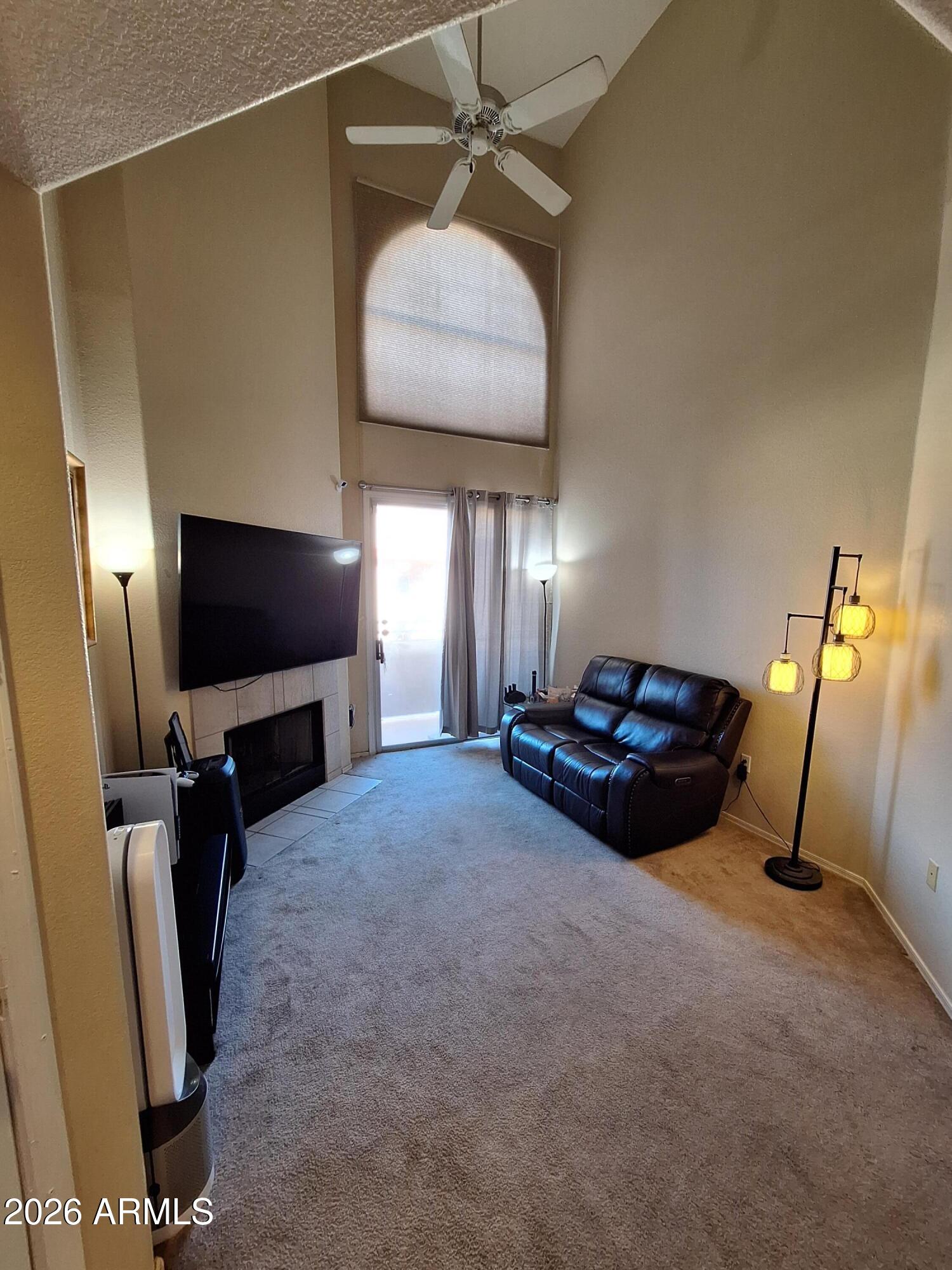 10410 North Cave Creek Road, Unit 2063 Phoenix, AZ 85020 - Photo 19 of 49 a living room with furniture and a flat screen tv