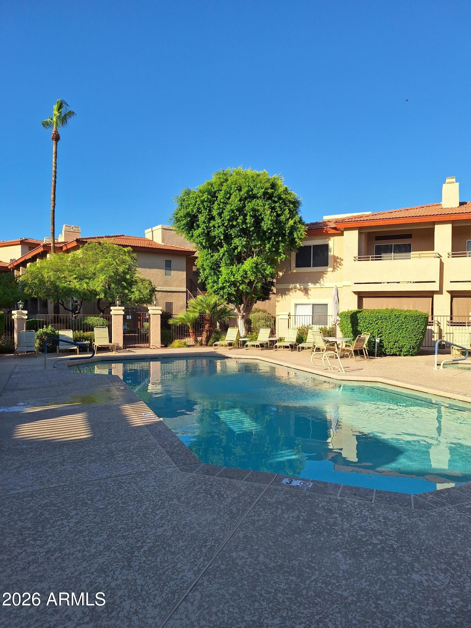 10410 North Cave Creek Road, Unit 2063 Phoenix, AZ 85020 - Photo 2 of 49 a view of a house with a yard