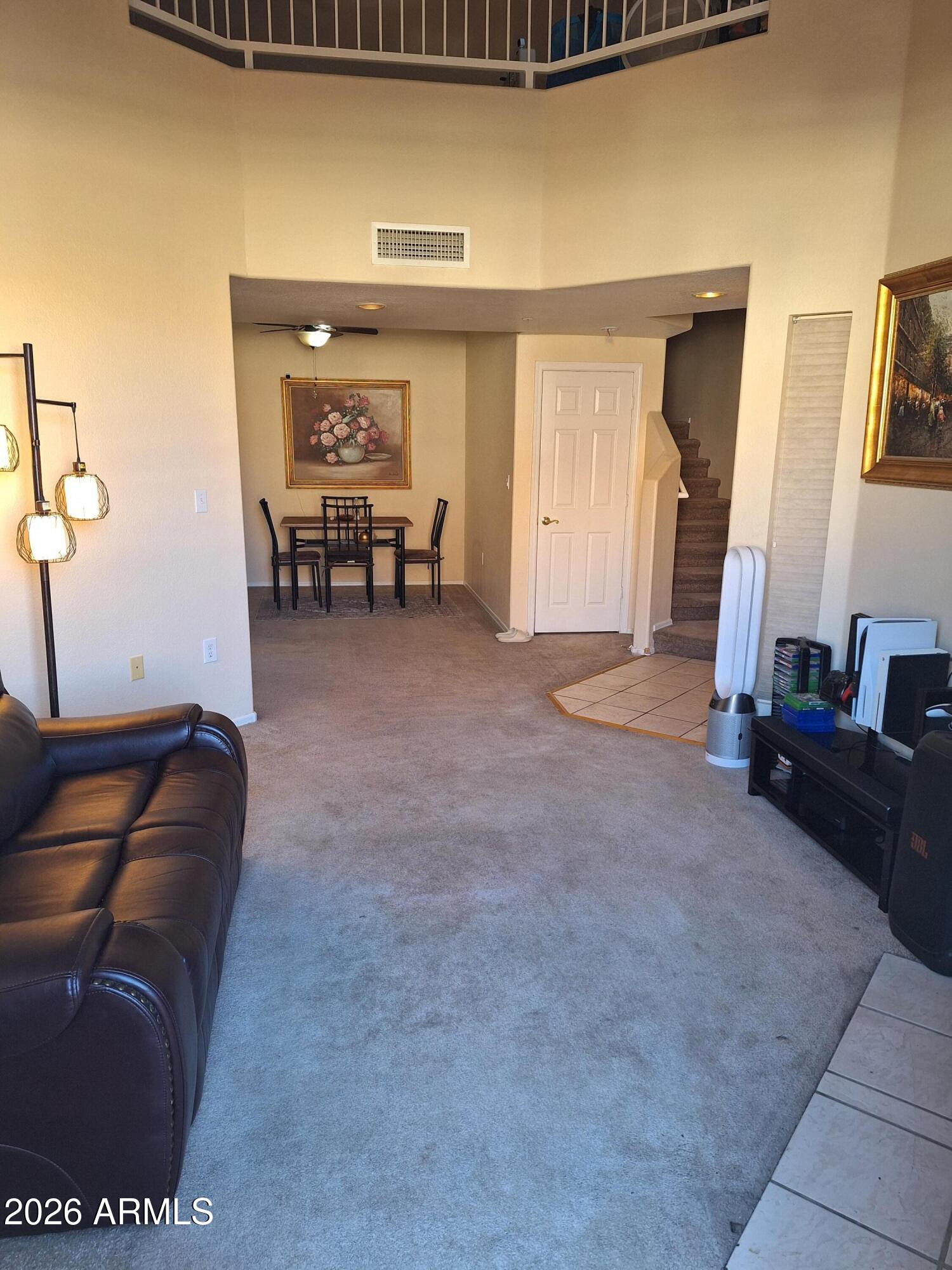 10410 North Cave Creek Road, Unit 2063 Phoenix, AZ 85020 - Photo 25 of 49 a living room with furniture and a mirror
