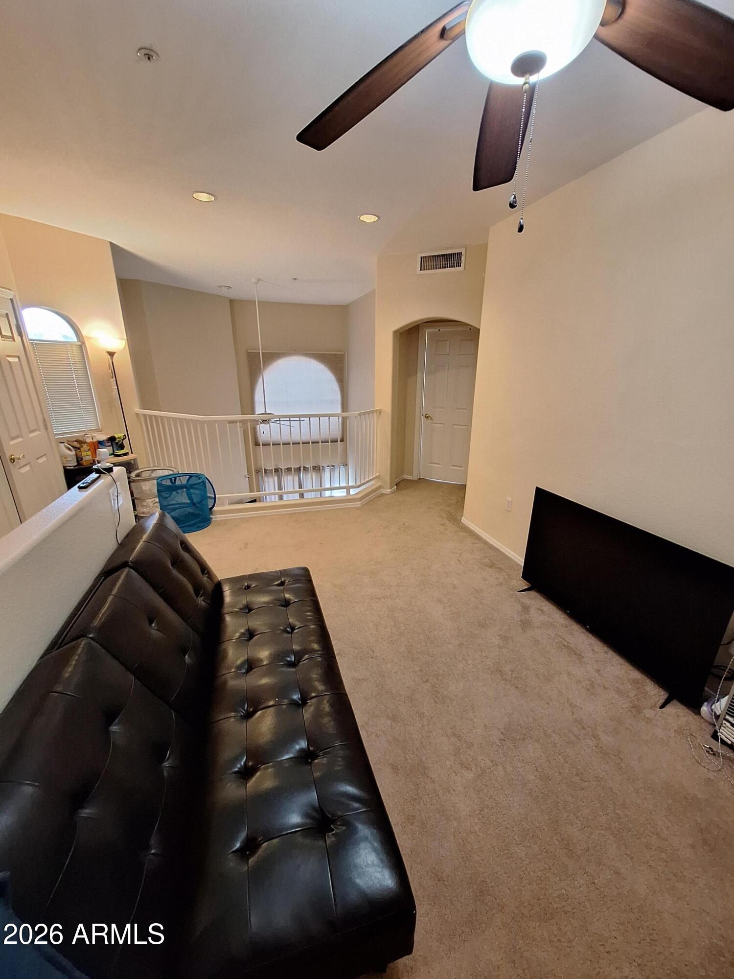 10410 North Cave Creek Road, Unit 2063 Phoenix, AZ 85020 - Photo 39 of 49 a view of hallway with windows and chandelier