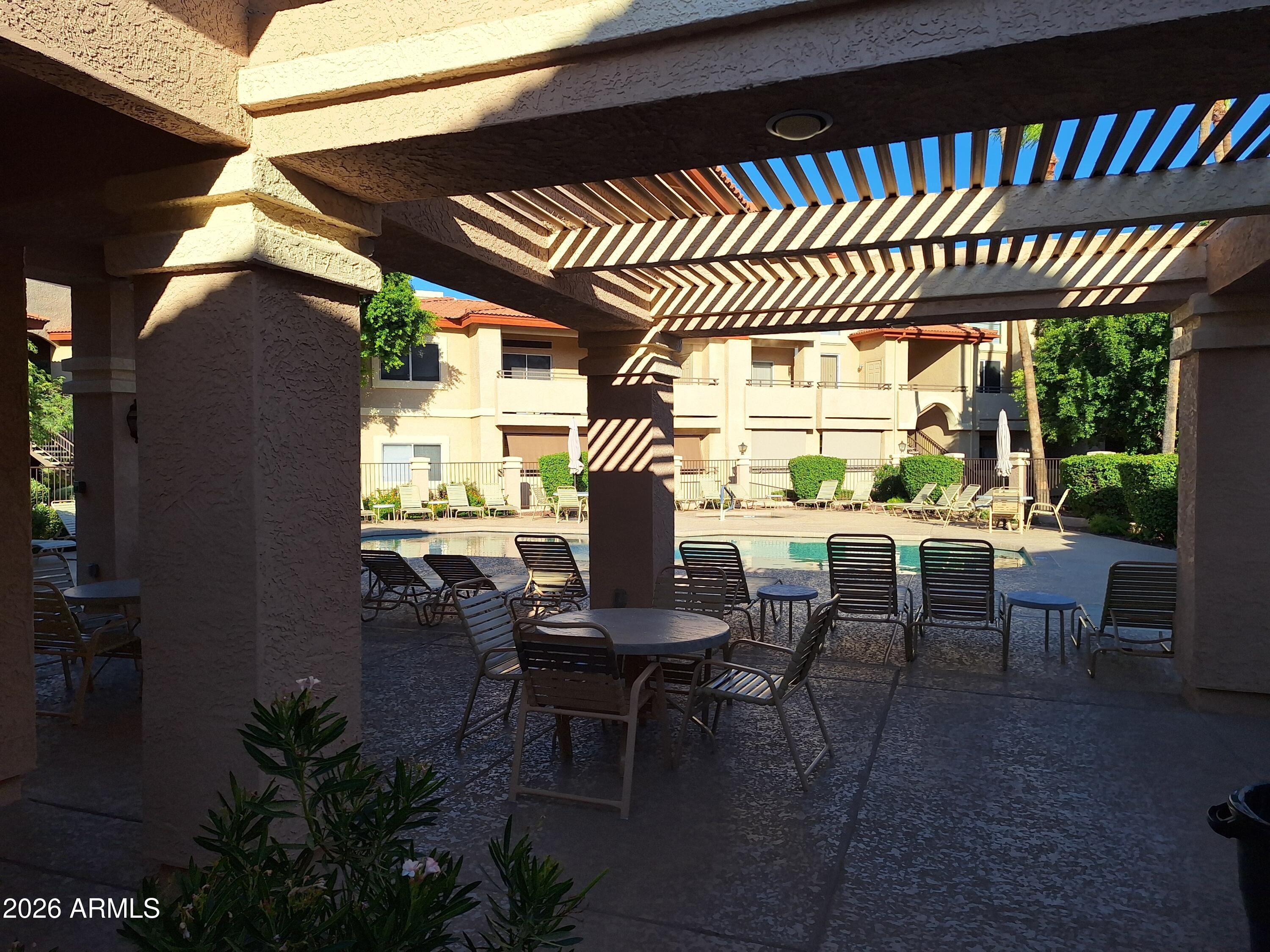 10410 North Cave Creek Road, Unit 2063 Phoenix, AZ 85020 - Photo 4 of 49 a view of a porch with furniture and yard