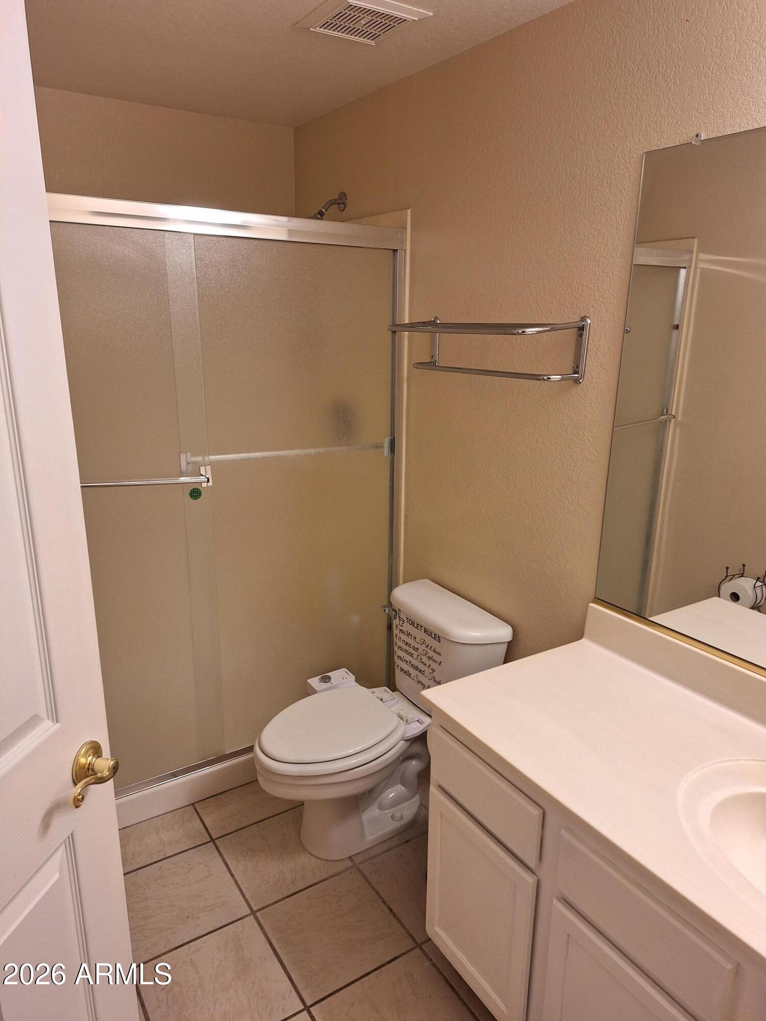 10410 North Cave Creek Road, Unit 2063 Phoenix, AZ 85020 - Photo 45 of 49 a bathroom with a sink a toilet and a shower