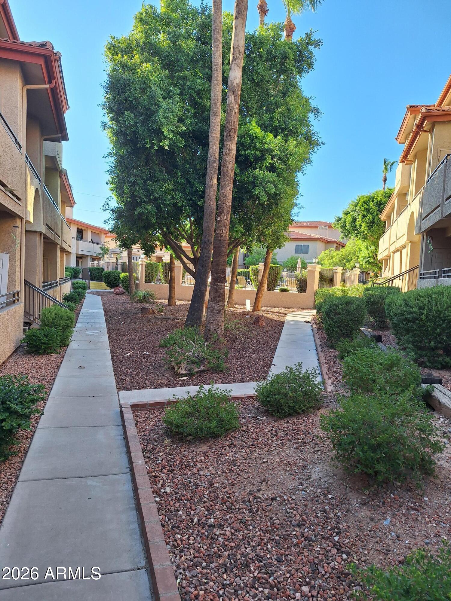 10410 North Cave Creek Road, Unit 2063 Phoenix, AZ 85020 - Photo 10 of 49 a view of a street with a houses on both side of the road