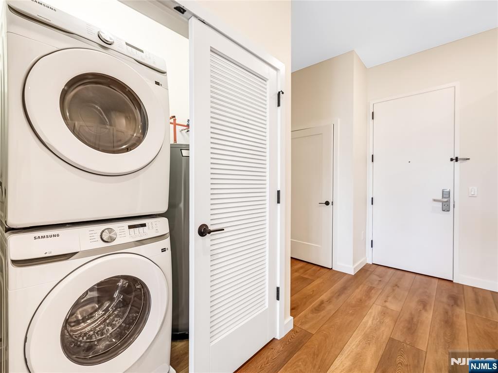 51 Queen Anne Road, Unit 405 Bogota, NJ 07603 - Photo 9 of 17 a view of a hallway with washer and dryer