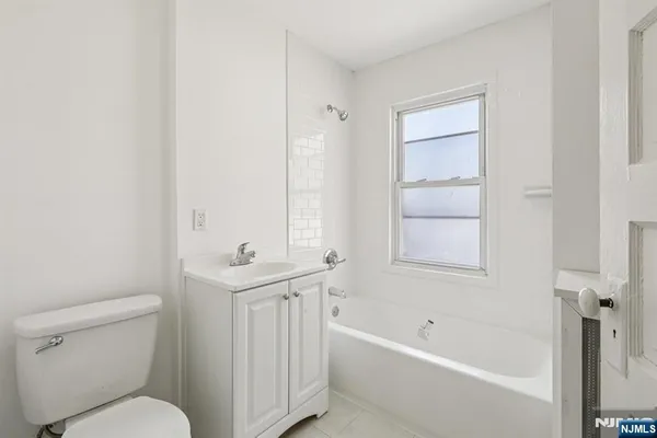 a bathroom with a sink a toilet and a bathtub