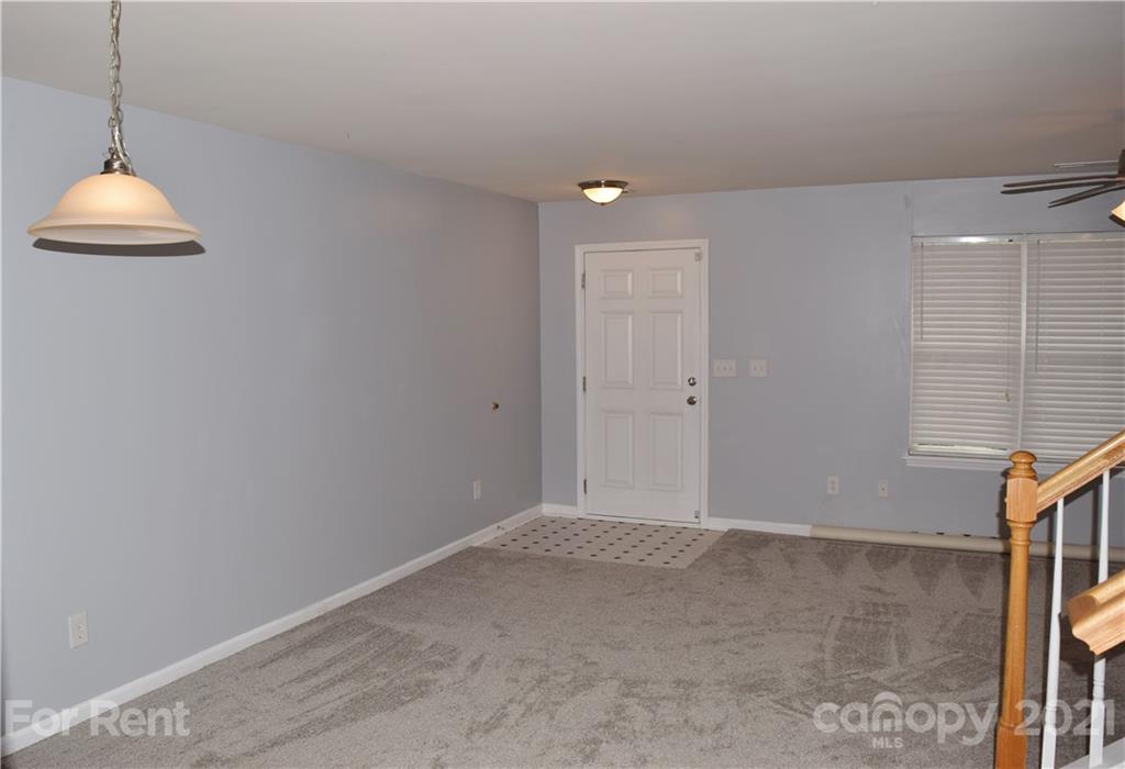 138 Limerick Road Mooresville, NC 28115 - Photo 11 of 33 a view of an empty room with window and a chandelier fan