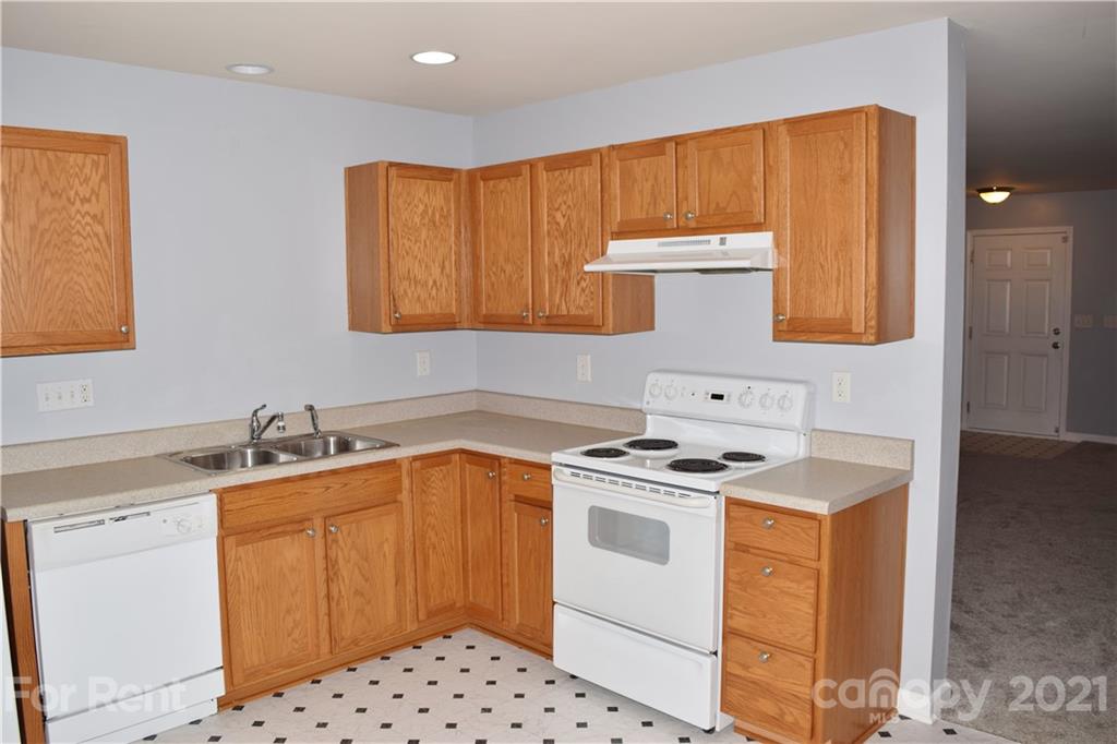 138 Limerick Road Mooresville, NC 28115 - Photo 14 of 33 a kitchen with a sink stove and cabinets