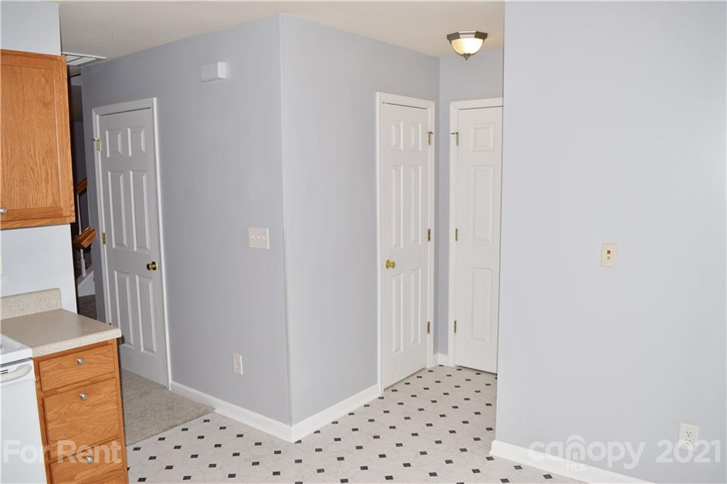 138 Limerick Road Mooresville, NC 28115 - Photo 16 of 33 a view of a hallway with wooden floor and a cabinet