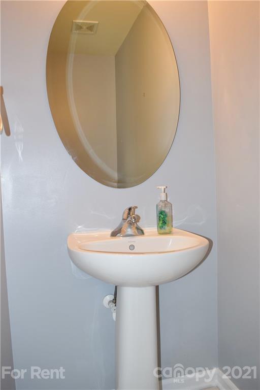 138 Limerick Road Mooresville, NC 28115 - Photo 19 of 33 a bathroom with a sink and a mirror
