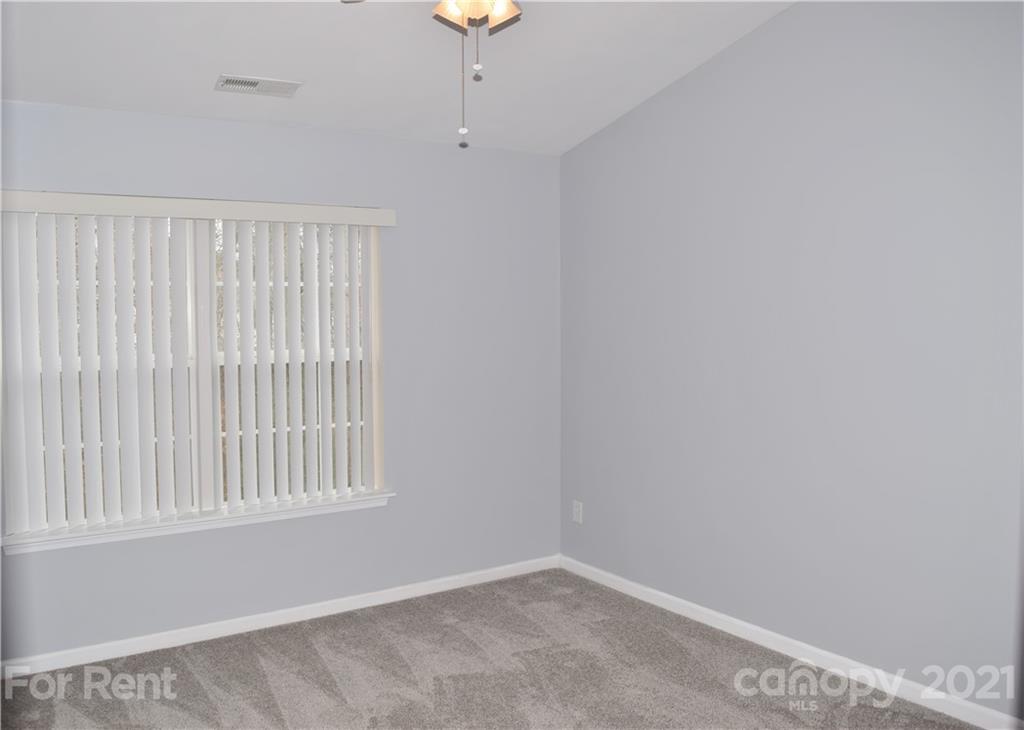 138 Limerick Road Mooresville, NC 28115 - Photo 20 of 33 an empty room with windows