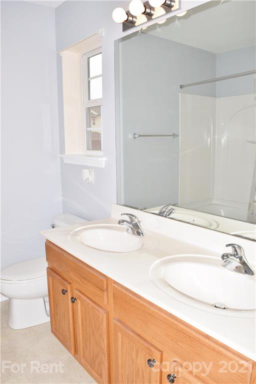 138 Limerick Road Mooresville, NC 28115 - Photo 22 of 33 a bathroom with a sink and a mirror