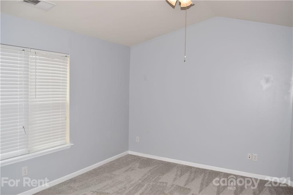 138 Limerick Road Mooresville, NC 28115 - Photo 24 of 33 a view of an empty room with windows