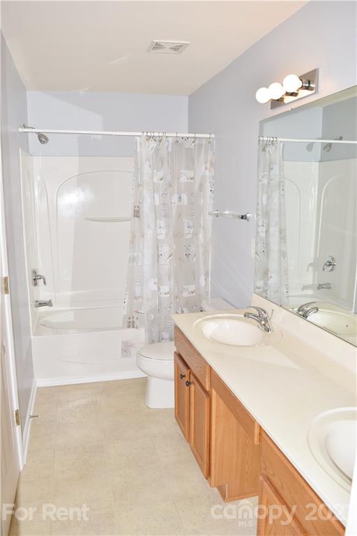 138 Limerick Road Mooresville, NC 28115 - Photo 26 of 33 a bathroom with a bathtub shower sink vanity and toilet