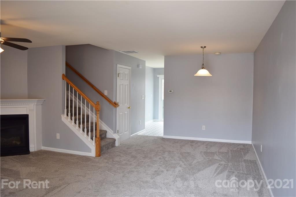 138 Limerick Road Mooresville, NC 28115 - Photo 4 of 33 a view of an empty room with stairs and a window