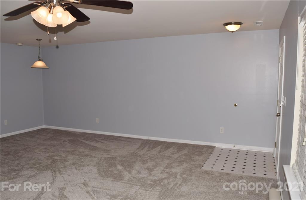 138 Limerick Road Mooresville, NC 28115 - Photo 6 of 33 a view of an empty room with a chandelier fan