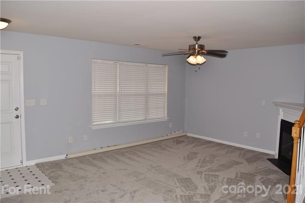 138 Limerick Road Mooresville, NC 28115 - Photo 8 of 33 a view of empty room with wooden floor and fan