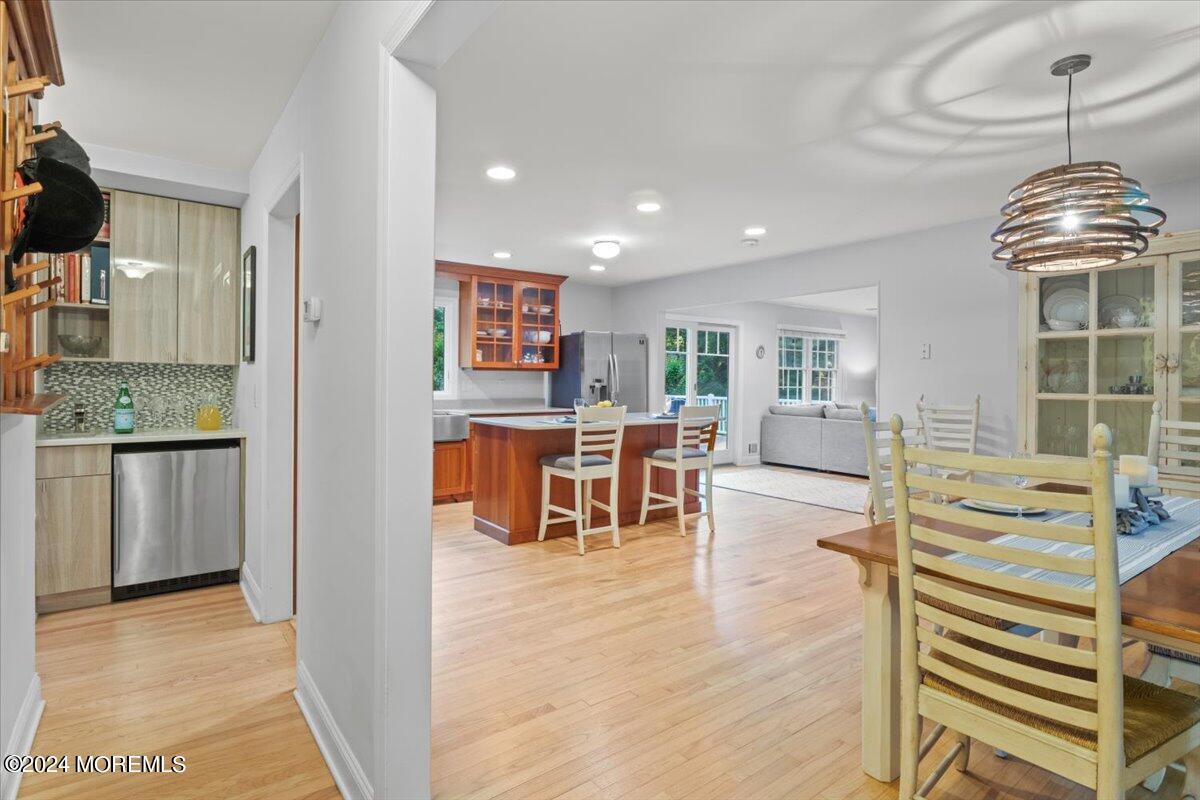676 Locust Point Road Atlantic Highlands, NJ 07716 - Photo 13 of 56 a view of kitchen with dining room and wooden floor