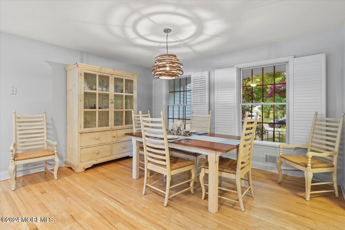 676 Locust Point Road Atlantic Highlands, NJ 07716 - Photo 14 of 56 a view of a dining room with furniture window and wooden floor