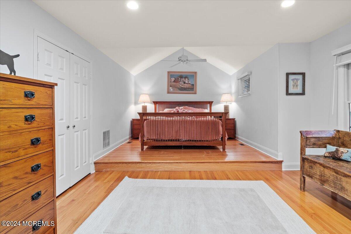 676 Locust Point Road Atlantic Highlands, NJ 07716 - Photo 20 of 56 a living room with a dresser and gym equipment