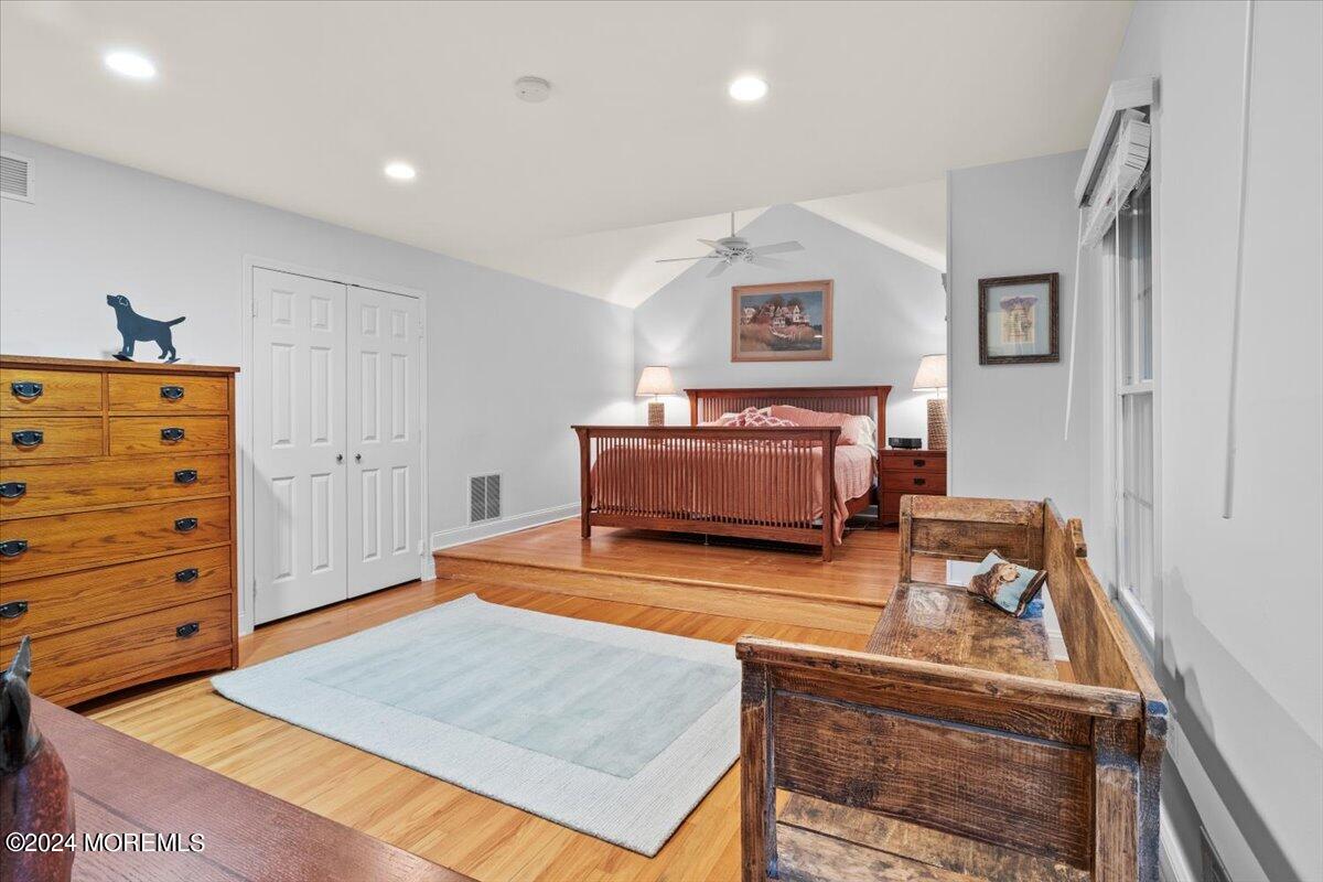 676 Locust Point Road Atlantic Highlands, NJ 07716 - Photo 21 of 56 a living room with furniture and a flat screen tv