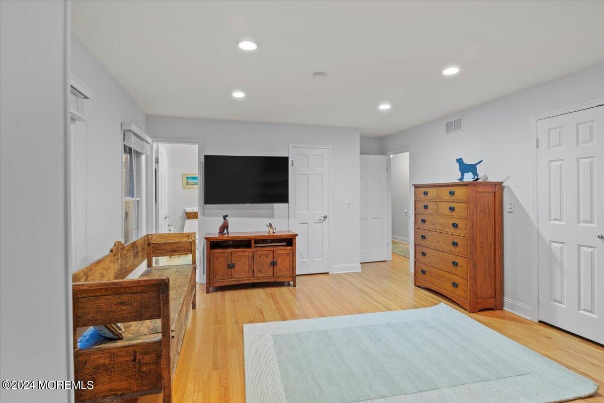 676 Locust Point Road Atlantic Highlands, NJ 07716 - Photo 23 of 56 a living room with furniture and a flat screen tv