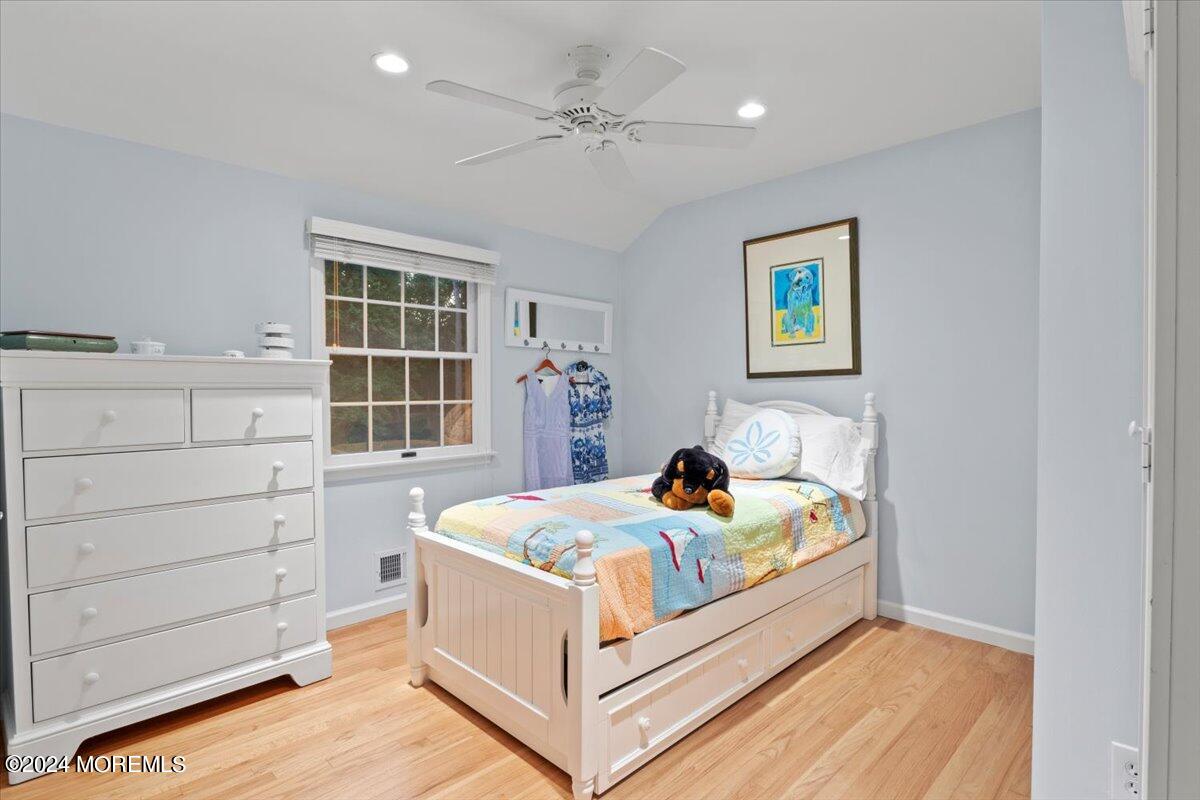 676 Locust Point Road Atlantic Highlands, NJ 07716 - Photo 24 of 56 a bed room with a bed and a window