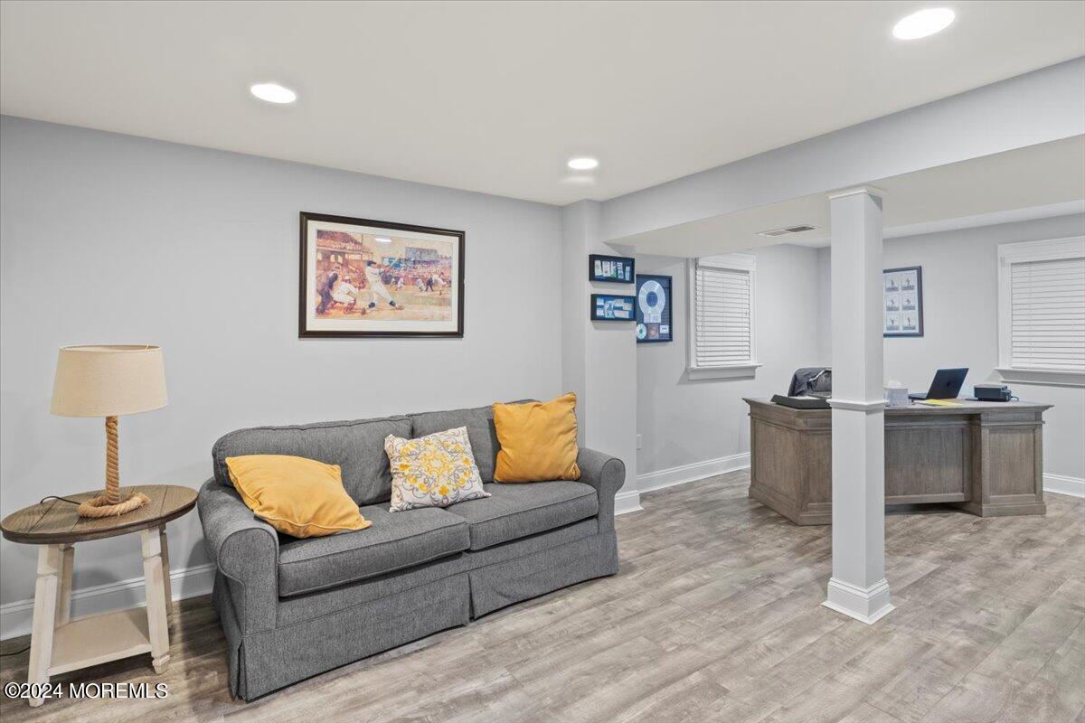 676 Locust Point Road Atlantic Highlands, NJ 07716 - Photo 29 of 56 a living room with furniture and a lamp