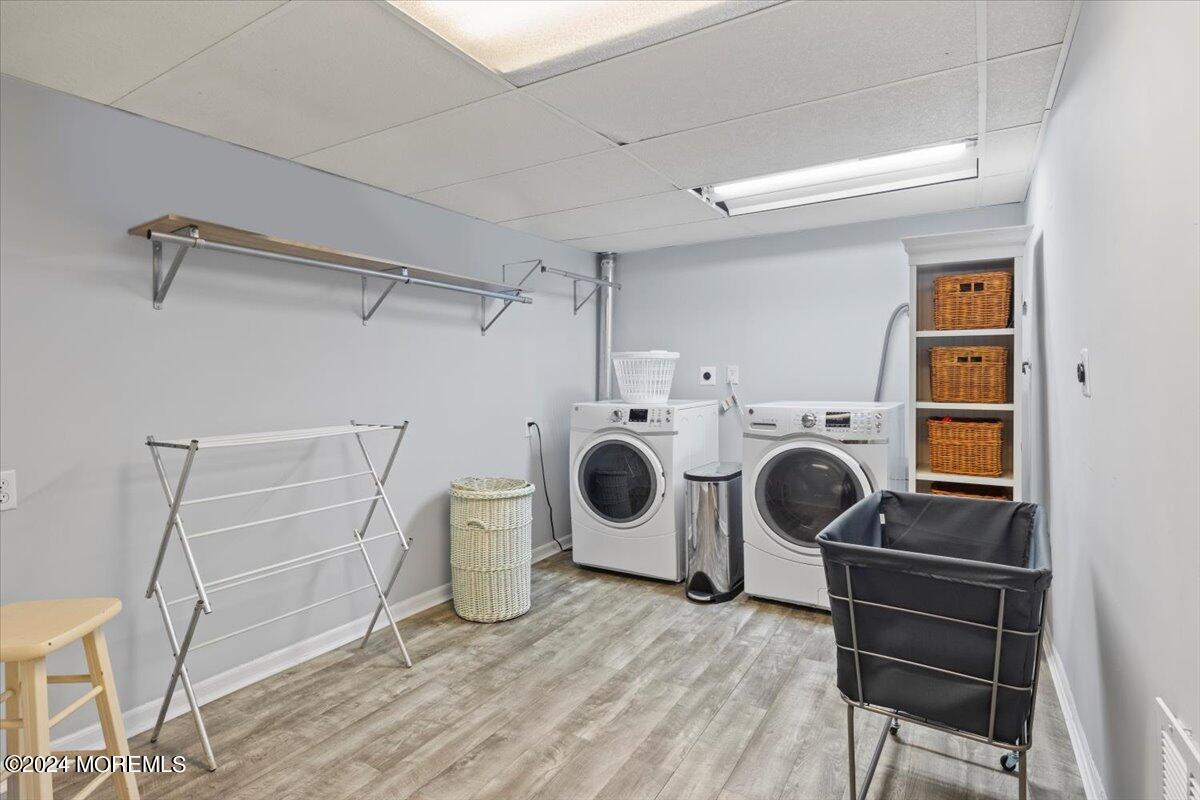 676 Locust Point Road Atlantic Highlands, NJ 07716 - Photo 34 of 56 a view of a storage & utility room with washer and dryer