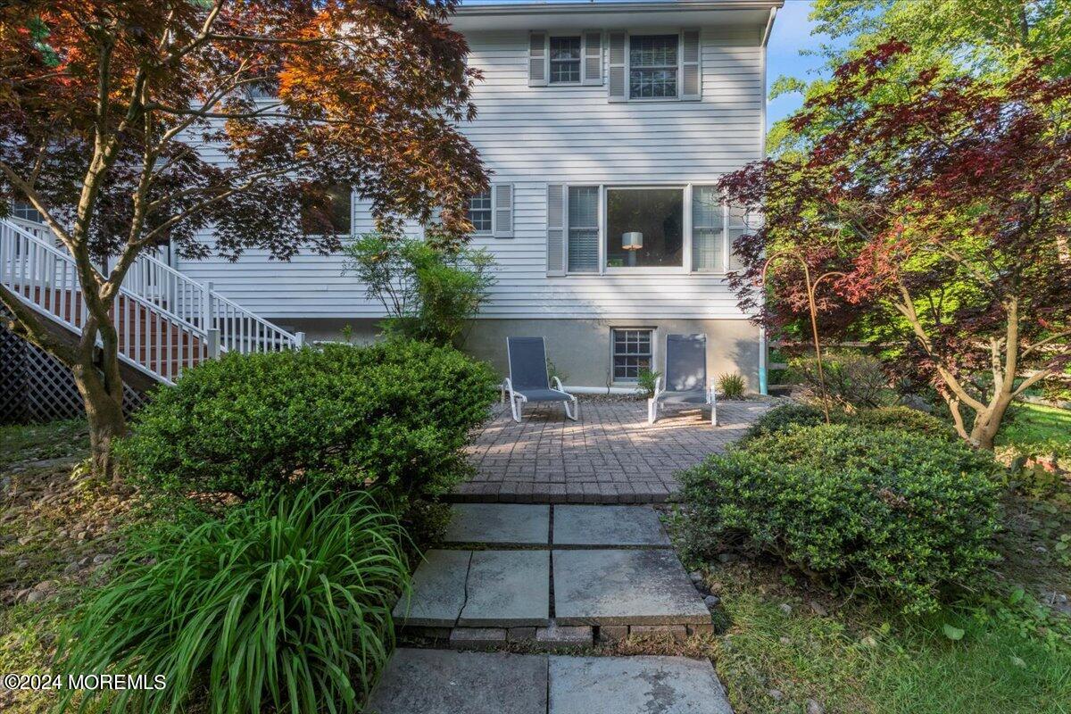 676 Locust Point Road Atlantic Highlands, NJ 07716 - Photo 38 of 56 a front view of a house with garden