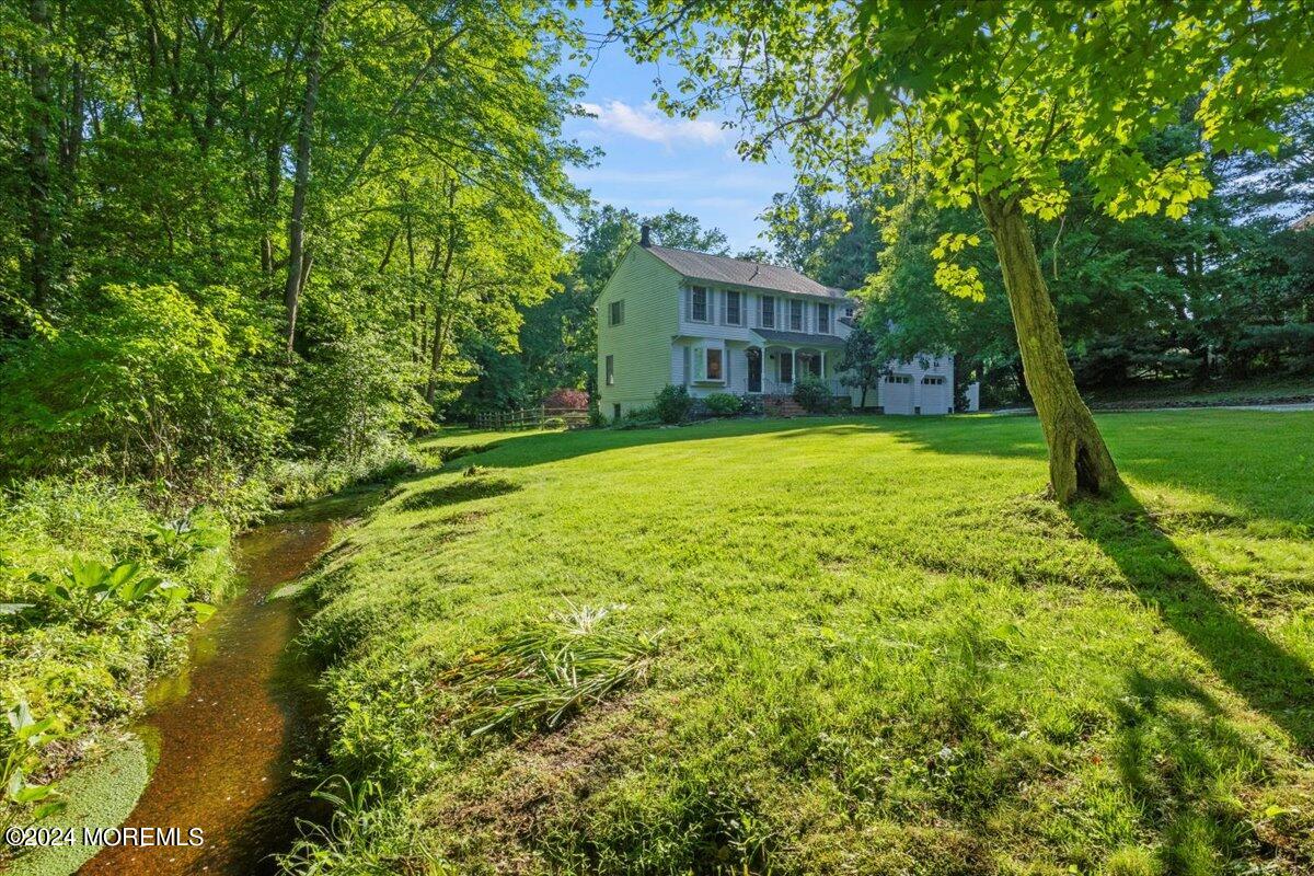 676 Locust Point Road Atlantic Highlands, NJ 07716 - Photo 40 of 56 a view of a house with a yard
