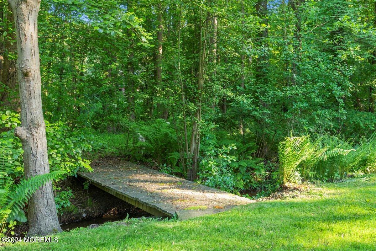 676 Locust Point Road Atlantic Highlands, NJ 07716 - Photo 46 of 56 a wooden fence with trees in the background