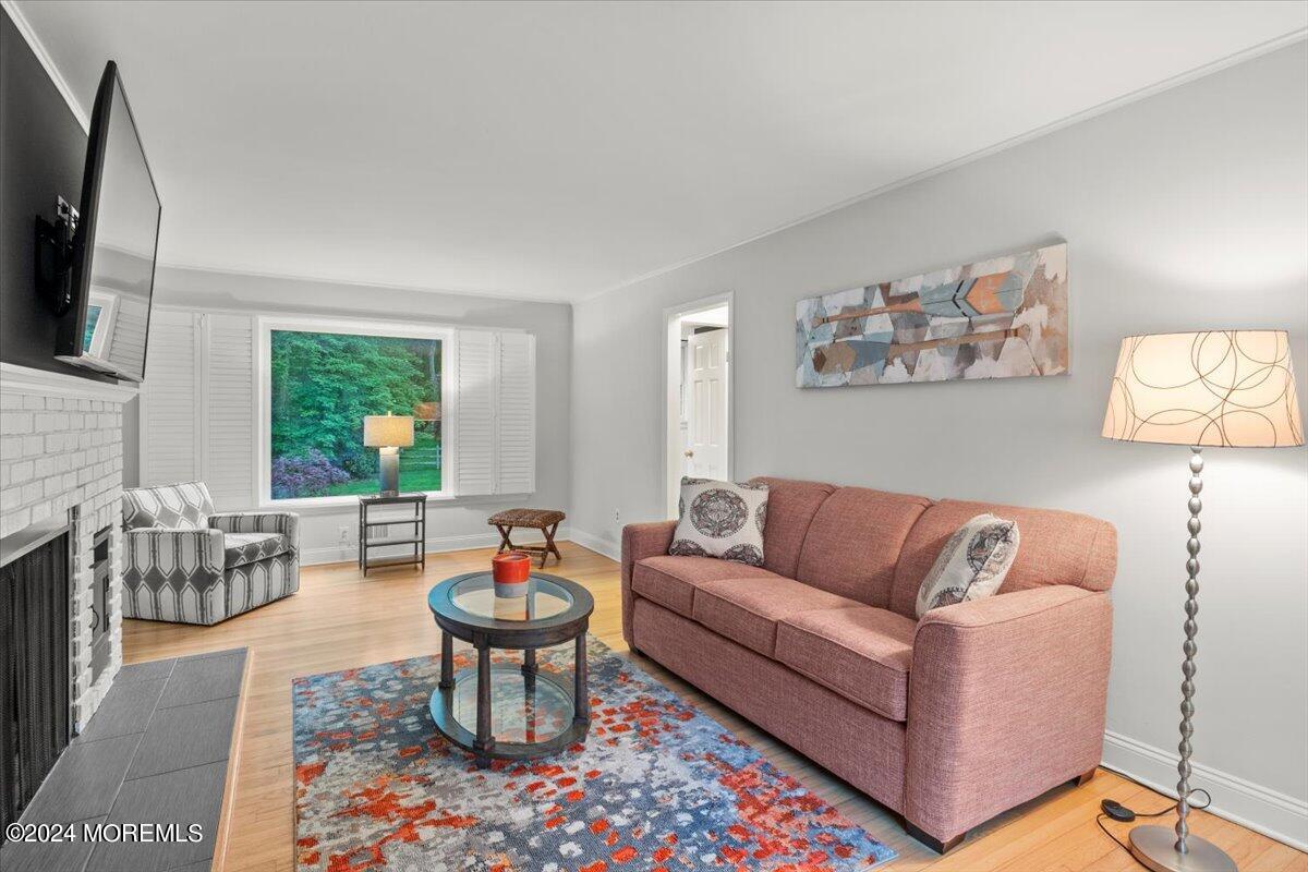 676 Locust Point Road Atlantic Highlands, NJ 07716 - Photo 8 of 56 a living room with furniture fireplace and a large window