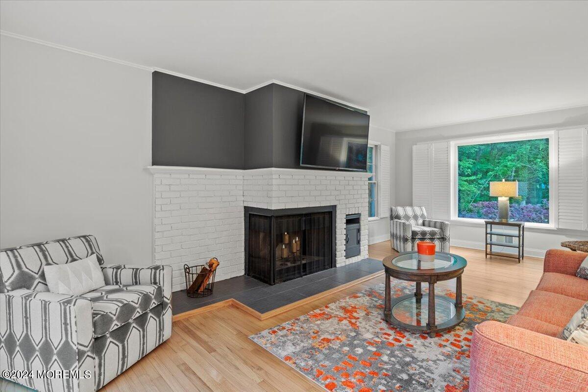 676 Locust Point Road Atlantic Highlands, NJ 07716 - Photo 9 of 56 a living room with furniture and a fireplace