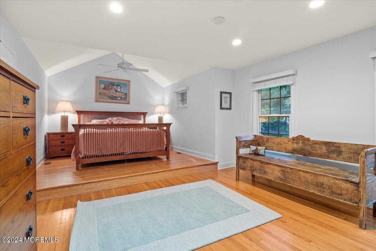 676 Locust Point Road Atlantic Highlands, NJ 07716 - Photo 10 of 56 a bedroom with a bed and a couch