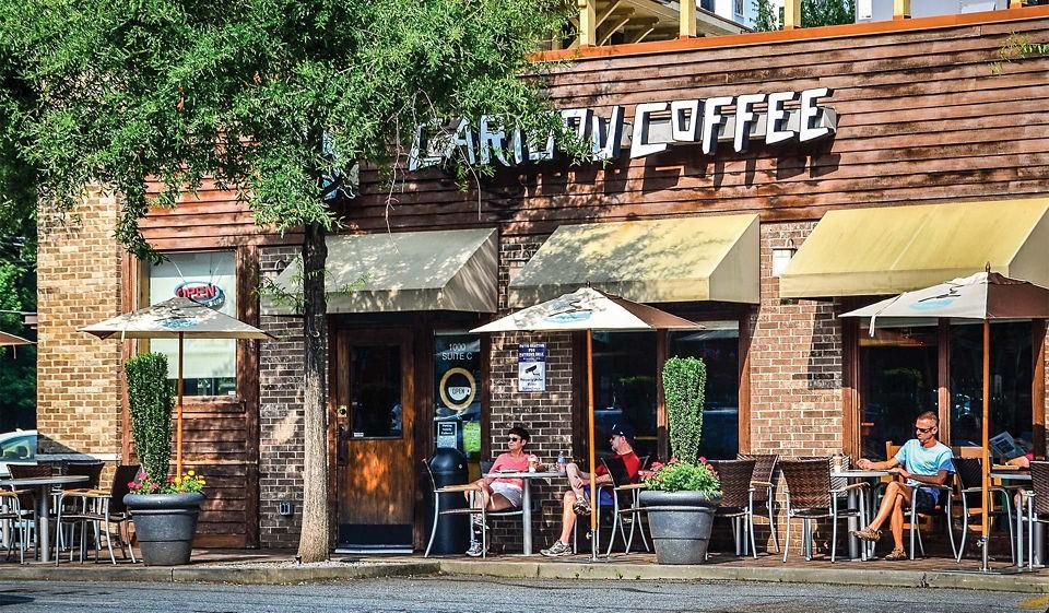1045 Piedmont Avenue Northeast, Unit 2B2BA Atlanta, GA 30309 - Photo 15 of 16 a group of people sitting in front of retail shop