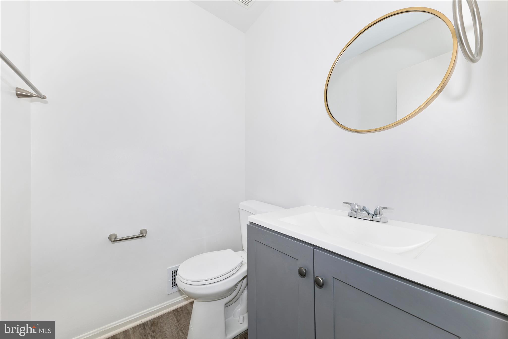 13303 Country Ridge Drive Germantown, MD 20874 - Photo 17 of 45 a bathroom with a sink a toilet and a mirror