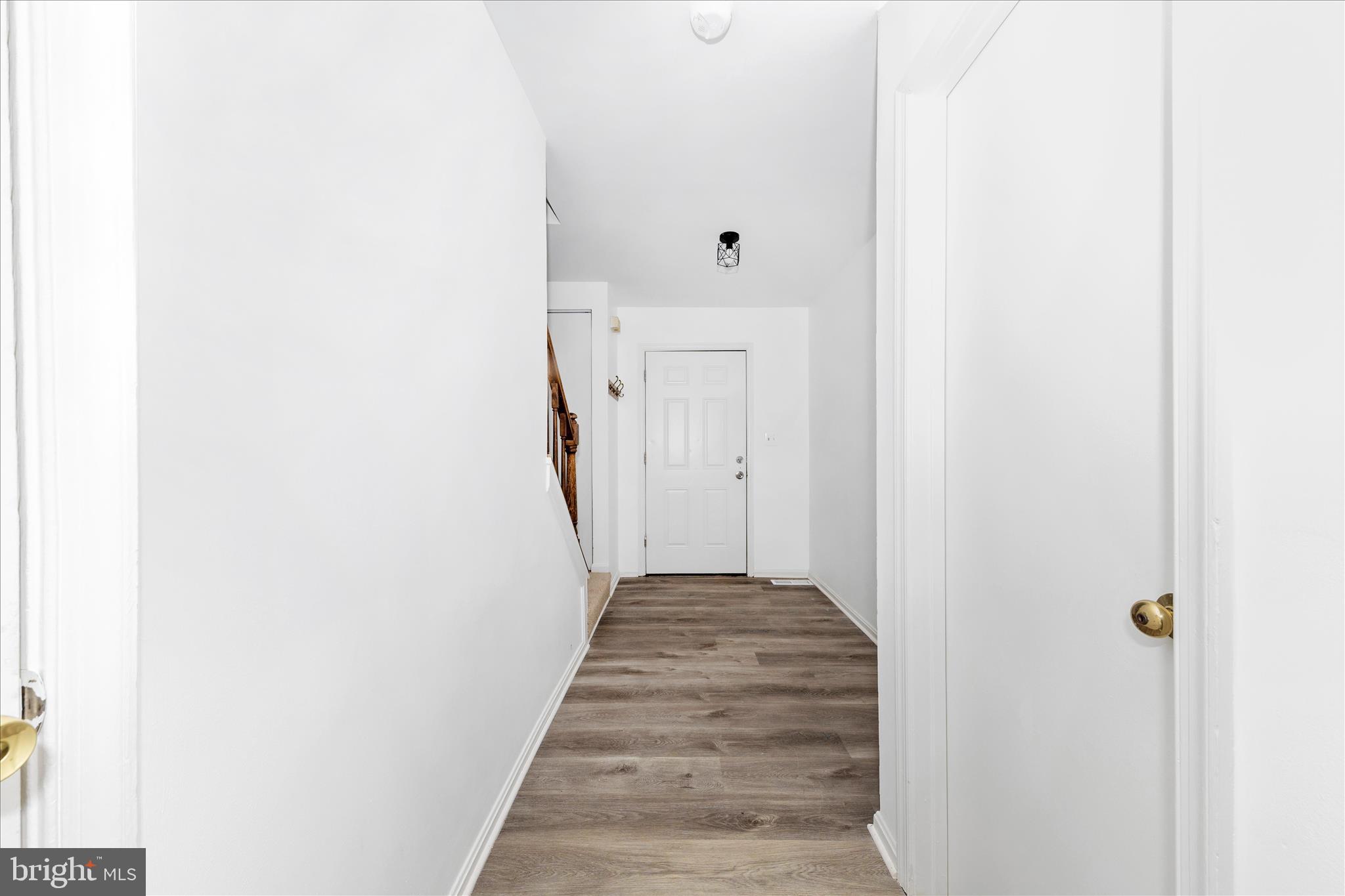 13303 Country Ridge Drive Germantown, MD 20874 - Photo 2 of 45 a view of a hallway with wooden floor