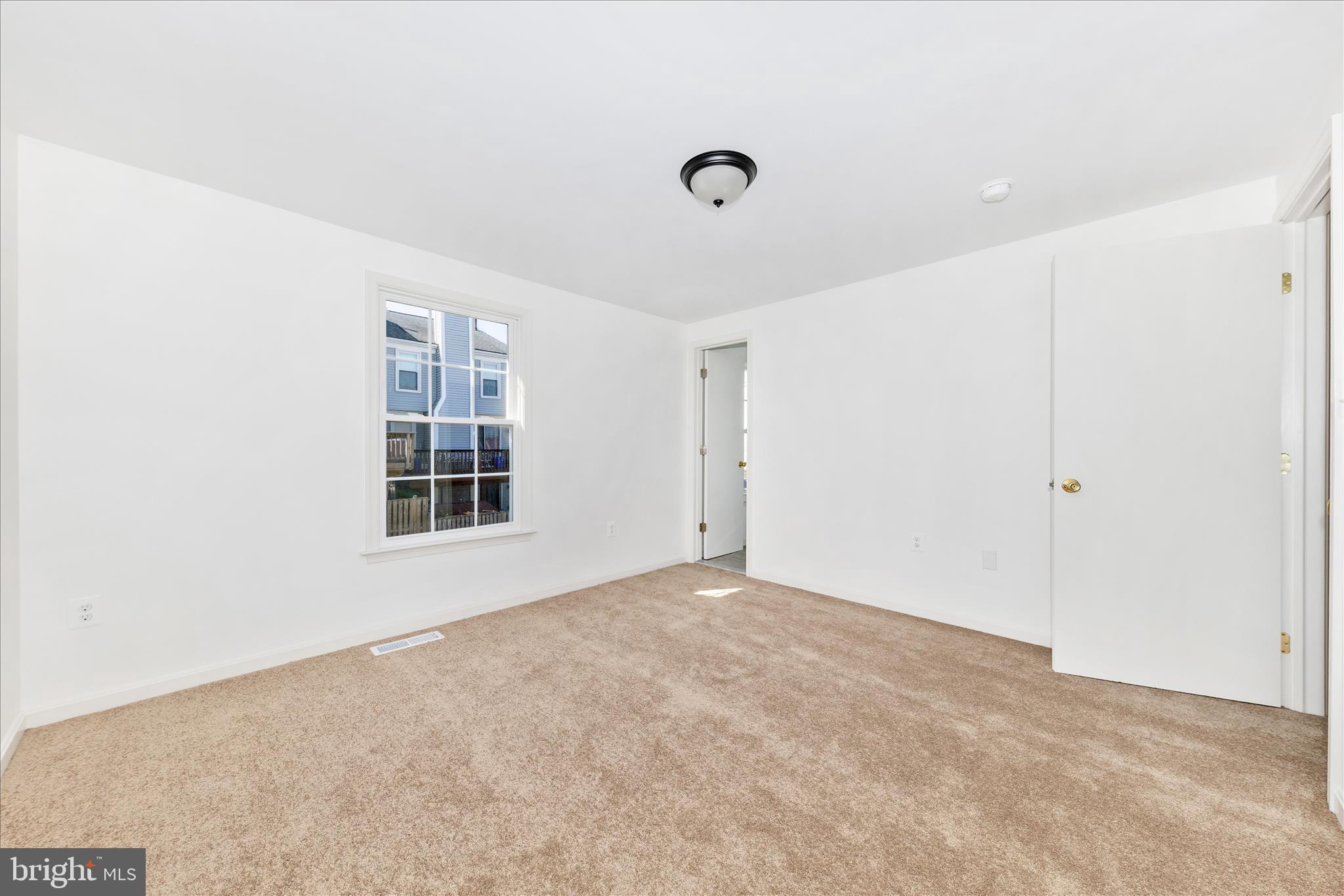 13303 Country Ridge Drive Germantown, MD 20874 - Photo 21 of 45 a view of an empty room with a window