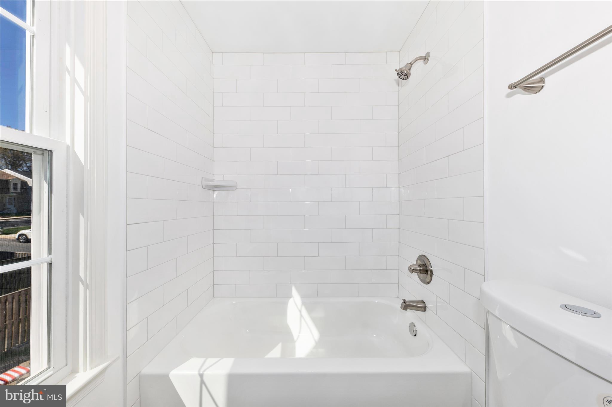 13303 Country Ridge Drive Germantown, MD 20874 - Photo 23 of 45 a bathroom with a bathtub
